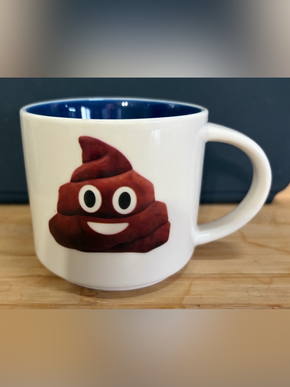 White Ceramic Mug with Brown Emoji Graphic and Navy Interior